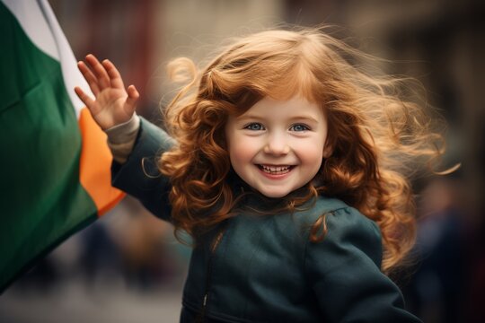 Young Irish Girl Waving Flag on City Street