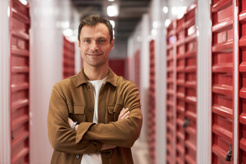 Portrait of smiling confident self-storage business owner