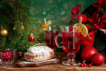 Christmas composition with two mugs of warming vitamin cranberry drink and stollen. Christmas and New Year home holidays concept.