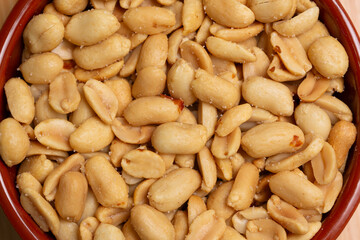 Close-up of peeled, roasted, salted peanuts background. Peanuts look delicious. 