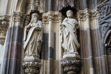 Gothic statues on portal to Basilica Minor of Saint Benedict in Hronsky Benadik, Slovakia