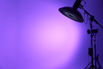Portrait flash close-up. The pulsed studio flash shines with a lilac light. Professional photo...