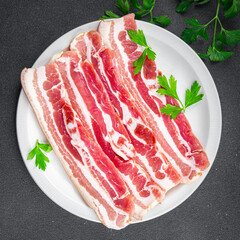 bacon slice fresh meat pork eating appetizer meal food snack on the table copy space food background rustic top view