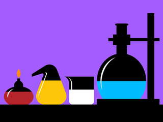 Equipment in a science lab including burner, glass jar, and flask