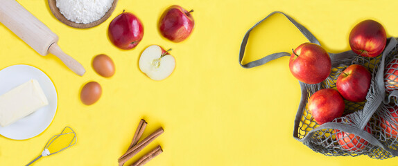 Ingredients for making apple pie or cake and mesh shopping  bag with red apples on the yellow ...