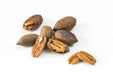 Assortment of peeled and shelled Pecan nuts on white background