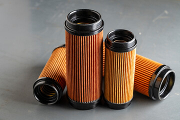 Air filters for engine car on grey background, closeup. Auto parts accessories for retro cars