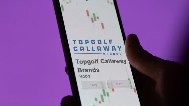 Topgolf Callaway Brands on a giant white screen, the brand  on a device.