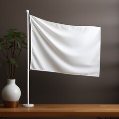 image of a blank white flag on a flagpole in a studio setting. The flag flutters in the wind and the background is a neutral gray. This image is perfect for designers who want to add their 