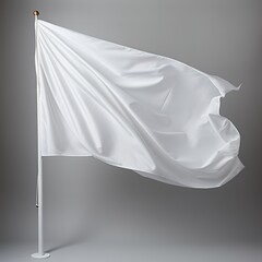 image of a blank white flag on a flagpole in a studio setting. The flag flutters in the wind and the background is a neutral gray. This image is perfect for designers who want to add their own design 