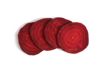 Sliced red raw beets lie on a white background.