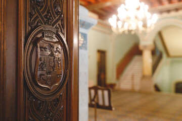 An Ornate Door with a Chandelier at Peles Castle Sinaia