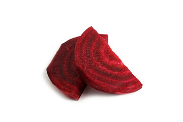 Pieces of red beets are on a white background.