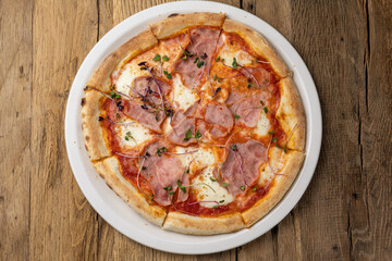 delicious pizza with ham and cheese
