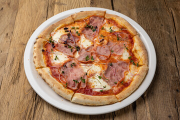 delicious pizza with ham and cheese