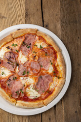 delicious pizza with ham and cheese