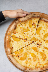 delicious pizza with oranges and cheese