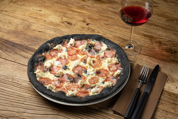 tasty pizza with salami and cheese