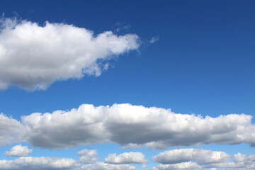 Naklejka na ściany i meble Sky background with white clouds. 