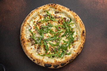 delicious pizza with meat, arugula and cheese