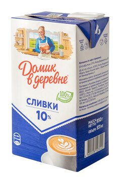 Packaging of milk cream of the &ldquo;Domik v Derevne&rdquo; brand on a transparent background. Dairy products, produced in Russia
