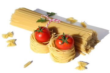 Knitted spaghetti lies on a white background with pasta nests and tomatoes.