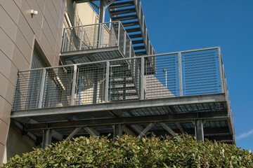 fire escape staircase, pedestrian passage for emergency exit. particular structure in galvanized stainless steel, with detail of the steel beams and their bolting.