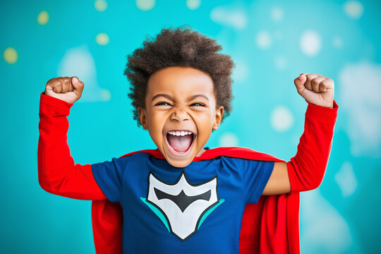 little superhero afro american boy throws up his fists and rejoices in his success