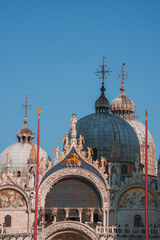 View of Basilica di San Marco and on piazza San Marco in Venice, Italy. Architecture and landmark of Venice. Sunrise cityscape of Venice.