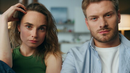 Focused pair staring tv show at home closeup. Man hand holding remote controller