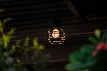 Vintage lamp on black background .