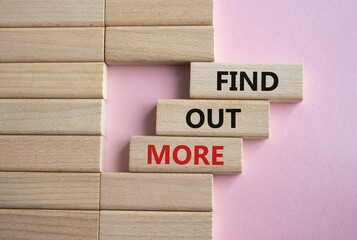 Find out more symbol. Concept word Find out more on wooden blocks. Beautiful pink background. Business and Find out more concept. Copy space - obrazy, fototapety, plakaty