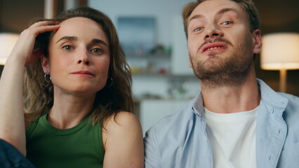 Pov carefree spouses talking together indoors. Relaxed couple discussing movie