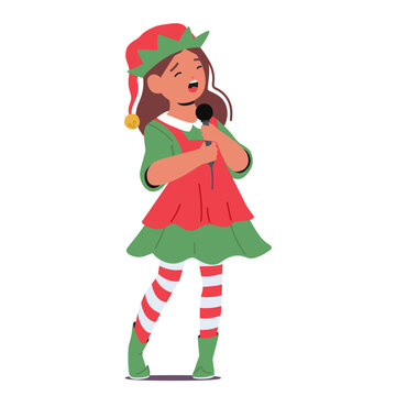 Girl In A Festive Christmas Costume of the Elf, Joyfully Sings Into A Microphone. Kid Character Spreading Holiday Cheer