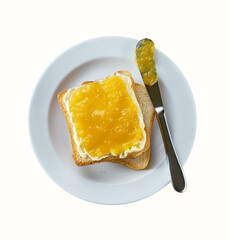 Delicious toast with lemon jam on a plate, isolated on a white background. Top view.