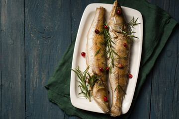 Baked pikes with rosemary and cranberries, a light Christmas meal
