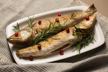 Baked pikes with rosemary and cranberries, a light Christmas meal