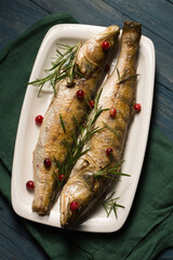 Baked pikes with rosemary and cranberries, a light Christmas meal