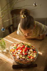 The girl is preparing vegetables