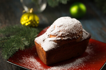 Fototapeta na wymiar Delicious Christmas cupcake with powdered sugar