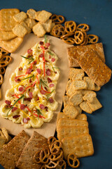 Butter board with sausages and spices in the shape of a Christmas tree