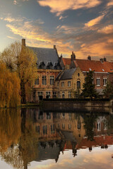 Naklejka na ściany i meble Bruges canal at sunset. Belgium