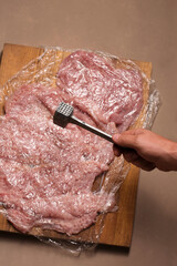 Preparation of turkey fillet for stuffing.