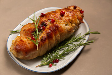 Christmas roll of turkey fillet stuffed with mushrooms and cheese