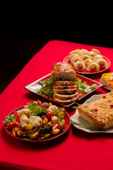 Traditional festive Christmas dishes on the table. Wellington with mushrooms, stuffed turkey roll