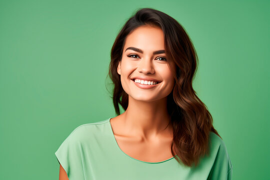 medium shot portrait photography of a pleased woman in her 30s against a light green background