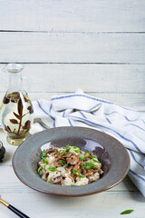 Italian cuisine - risotto with mushrooms. Cooked arborio rice with parmesan cheese and mushrooms