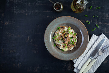 Italian cuisine - risotto with mushrooms. Cooked arborio rice with parmesan cheese and mushrooms