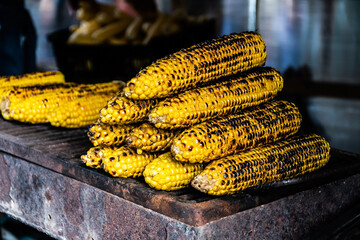 Baked corn for sale. Grill with baked corn.