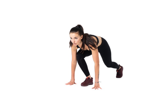 Female athlete in position to start running - isolated on transparent background